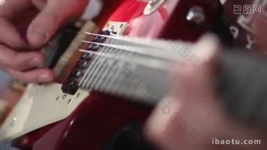 特写的摇滚<strong>音乐家</strong>手弹奏电吉他弦人玩电吉他与不同的技术